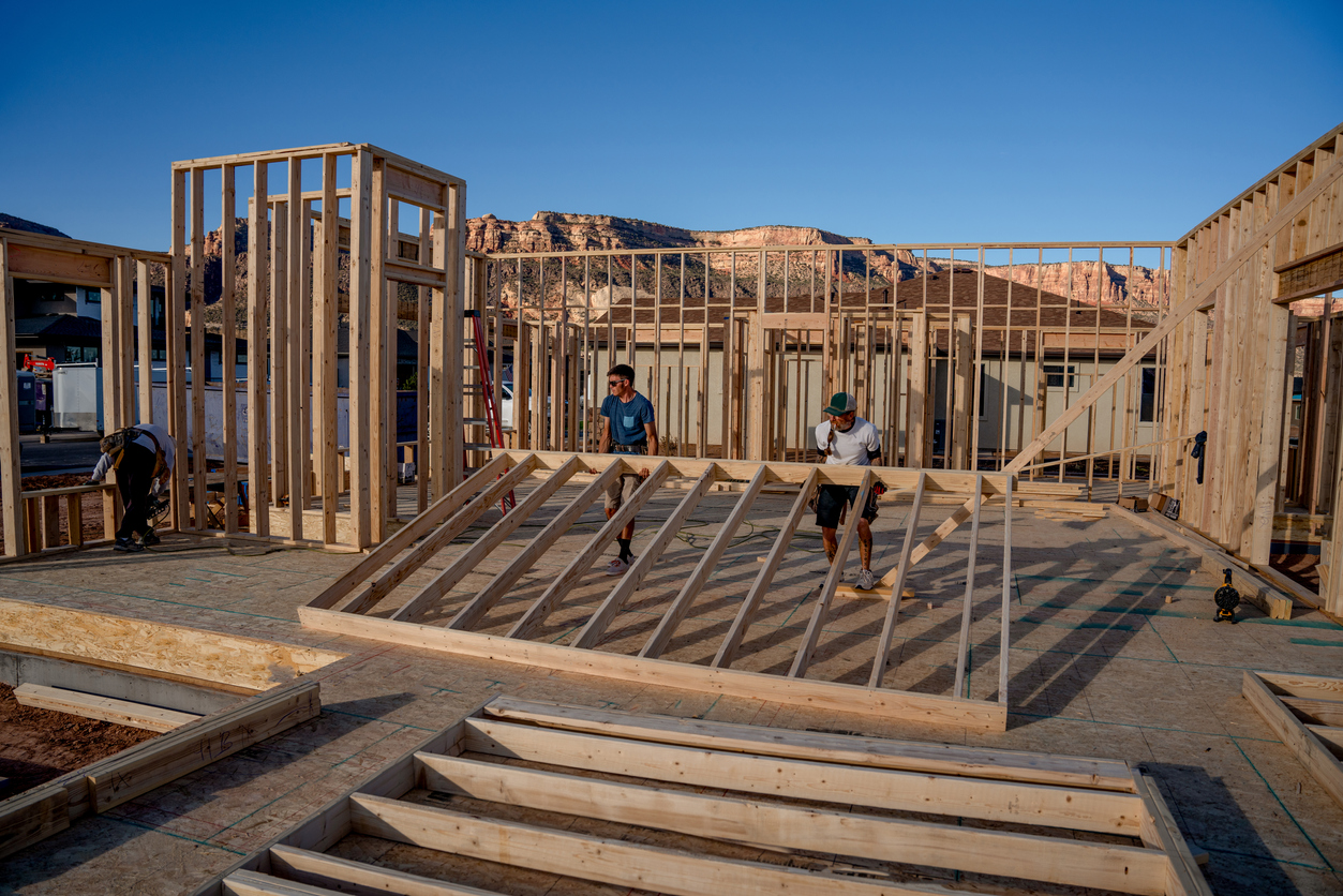 Framers Lift A Section Of Wall They Just Built, Setting In Place, New Home Construction In A Single Family Subdivision